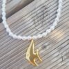 Collier en perles avec pendentif poisson